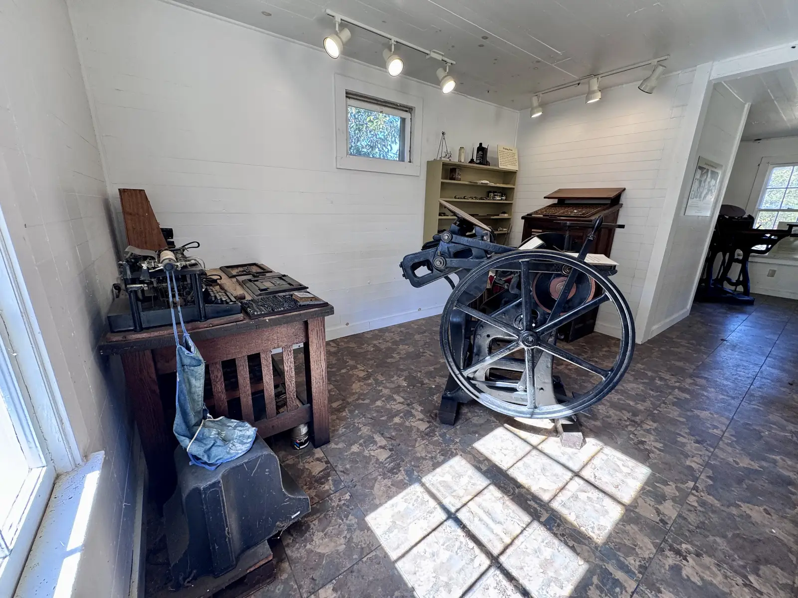 A small print shop's press room with a letterpress machine